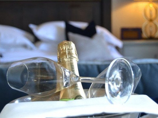 Bottle of bubbly in bedroom