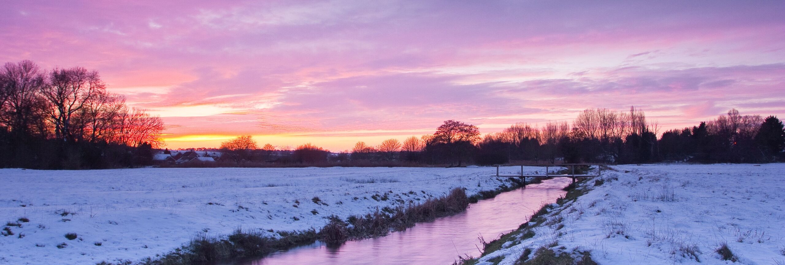 West Harnham, in Salisbury. The meadows are covered by a soft blanket of snow.