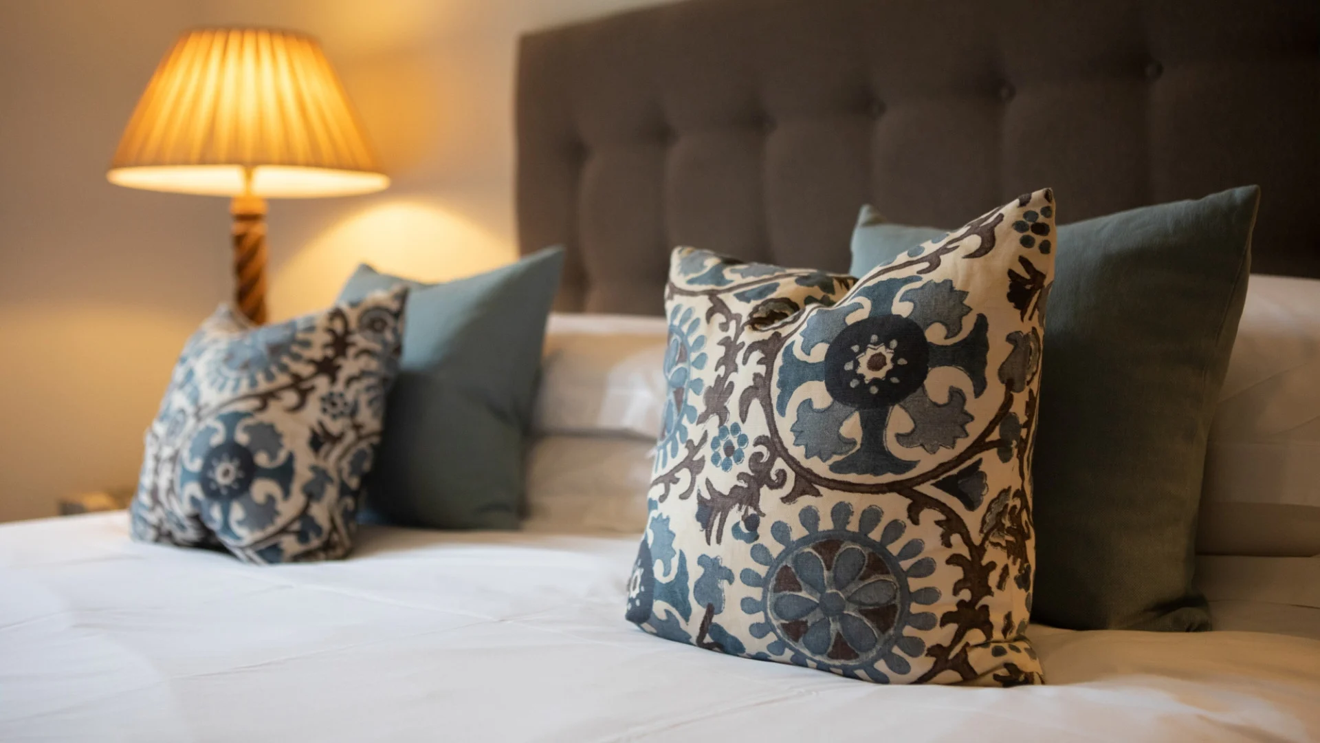 Bed with cushions and lamp